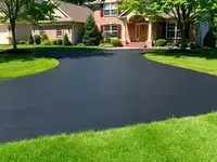 After: New smooth asphalt driveway