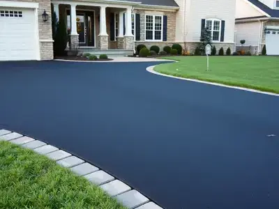 New asphalt driveway with paver border